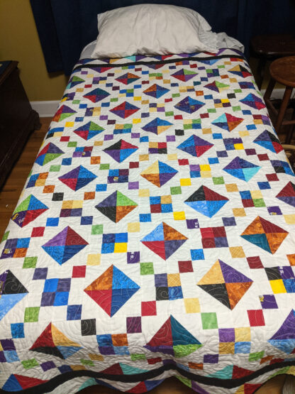 Colors of jewels quilts with blue backing, 78" by 59"